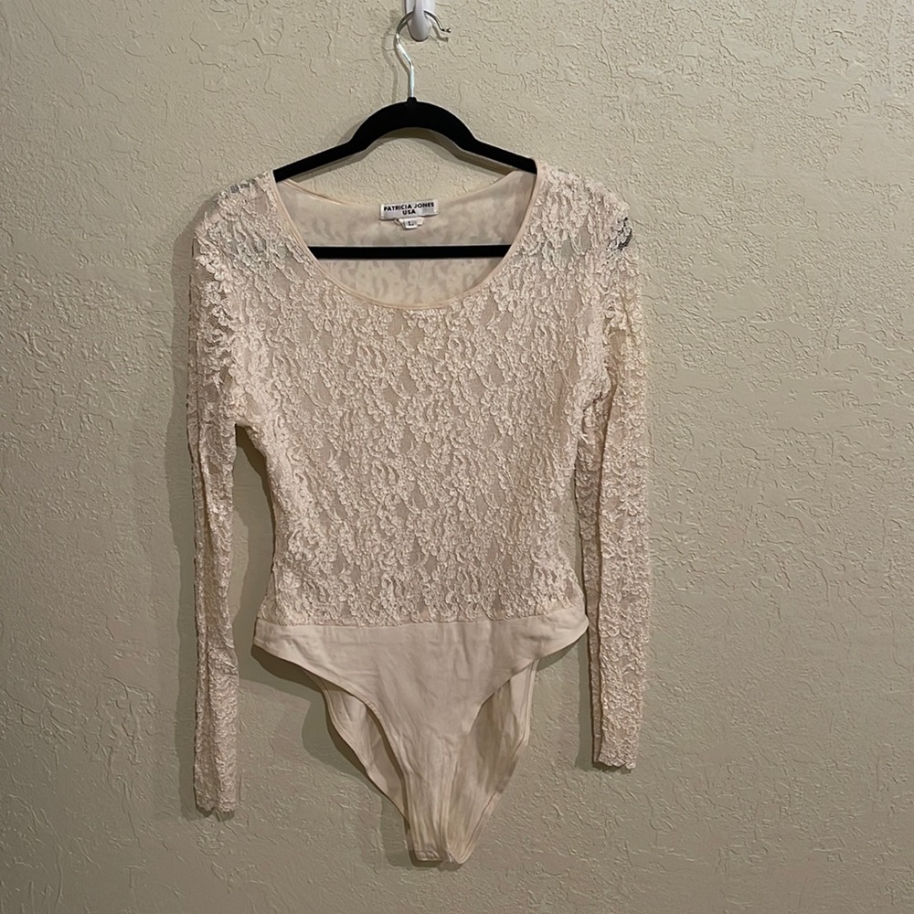 Cream lace body suit.